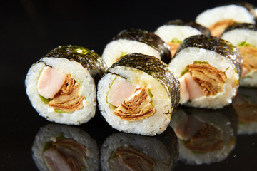 Traditional sushi roll with egg omelet and shred. Japanese food