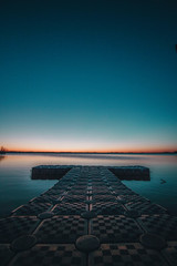 Remnants of sunset light up the horizon on this calm lake.