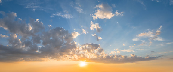 dramatic sunset over a cloudy sky, evening outdoor background