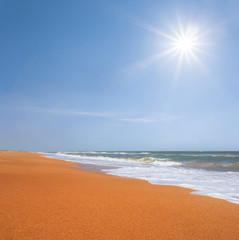 sandy sea beach at the sunny summer day