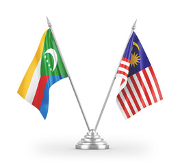 Malaysia and Comoros table flags isolated on white 3D rendering
