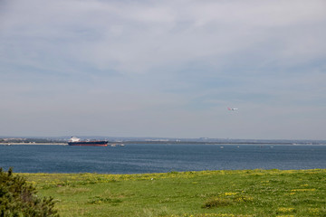 Fototapeta premium boat on the sea and airplane in heaven