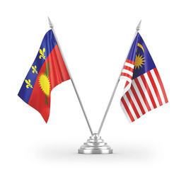 Malaysia and Guadeloupe table flags isolated on white 3D rendering