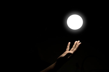 Hand Touching Source of Light