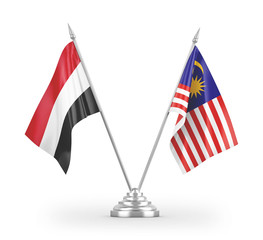 Malaysia and Yemen table flags isolated on white 3D rendering