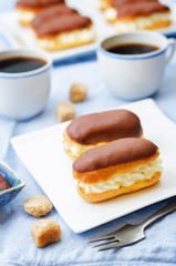 eclairs with cheese cream and chocolate glaze