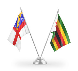 Zimbabwe and Herm table flags isolated on white 3D rendering