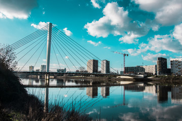 Reflection of a bridge over the Loire river in Nantes