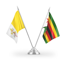 Zimbabwe and Vatican table flags isolated on white 3D rendering