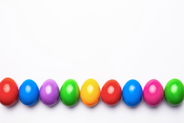 Flat lay composition made with Easter eggs on light background. Top view with place for text