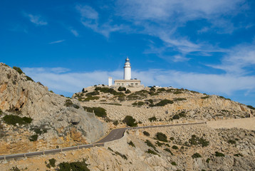 Beautiful scenery on the coast of Majorca. Lighthouse on the hill. Majorca, Spain