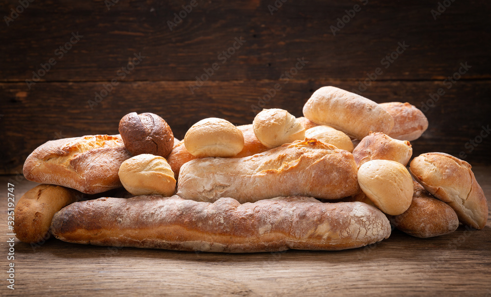 Sticker fresh baked bread on a wooden background