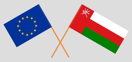 Crossed flags of Oman and the EU