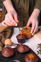 process making homemade chocolate cupcake with cream