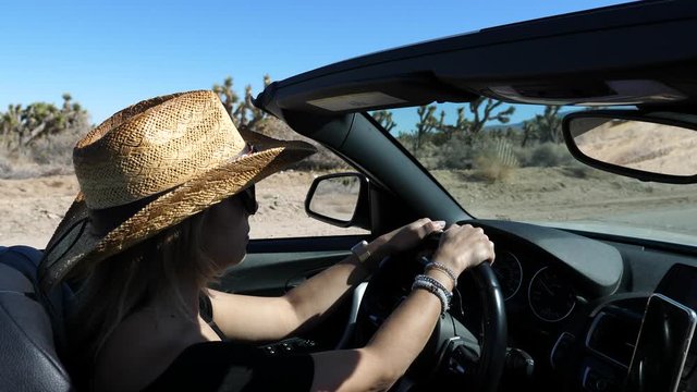 Cowgirl Driving Convertible