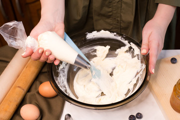 process making homemade chocolate cupcake with cream