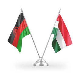 Hungary and Malawi table flags isolated on white 3D rendering