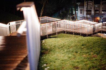 Illuminated wooden staircase in Kiev