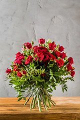 red roses on the wooden background