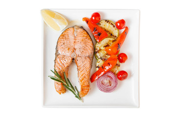 grilled salmon and vegetables on an isolated background