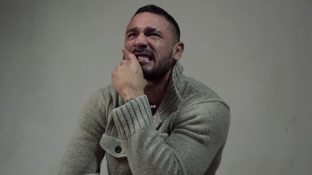 Crying drunk people. Alcoholism, alcohol addiction and people concept. Alcoholic depressed and drunk addict man crying on dramatic background. Man emotion.