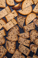 Brown bread croutons with seeds background