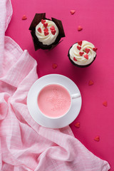 Red velvet cupcakes for Valentines Day in bright pink setting