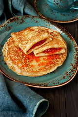 Classic Russian pancakes with red salmon caviar