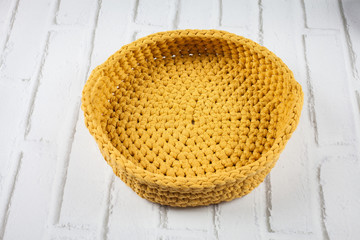 crochet basket made of yellow thread