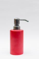 Fototapeta na wymiar hand soap dispenser in red