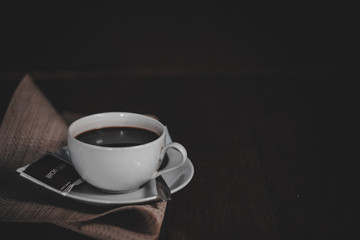 cup of coffee on wooden table