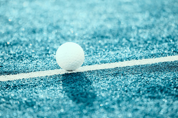 White ball for playing field hockey. Blue filter
