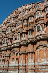 Fototapeta na wymiar The beautiful front façade of the Hawa Mahal, the palace of the winds. The Pink City, Jaipur, India.