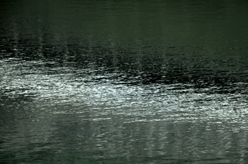 Fototapeta premium Eiger glacial ice reflected in alpine pool, Swiss Alps
