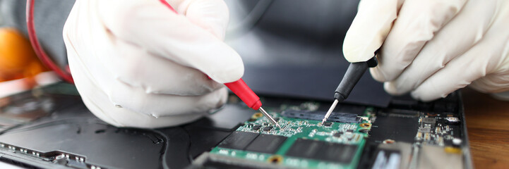 Close-up of male professional working with instruments and tools. Technician wearing protective...