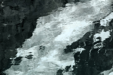 Eiger glacial ice reflected in alpine pool, Swiss Alps