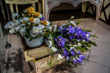 Decoration of various artificial flowers. Close-up of installation of inanimate flowers.