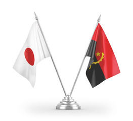 Angola and Japan table flags isolated on white 3D rendering