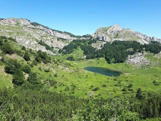 Mountain panorama with high peaks and glacier lake