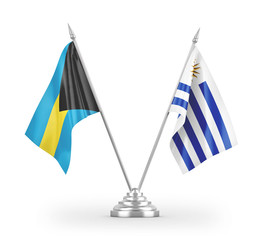 Uruguay and Bahamas table flags isolated on white 3D rendering