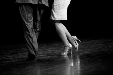 Graceful lines of legs of Argentina tango dancers - obrazy, fototapety, plakaty