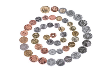 Lots of different coins isolated on white background.