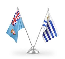 Uruguay and Fiji table flags isolated on white 3D rendering