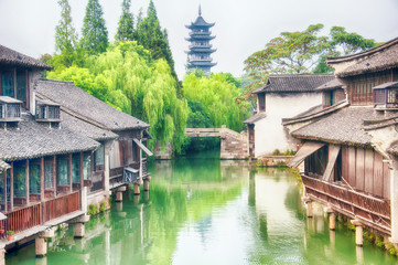 Fototapeta na wymiar wuzhen water town bridge and buildings china
