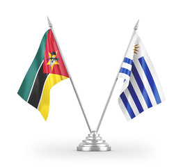 Uruguay and Mozambique table flags isolated on white 3D rendering