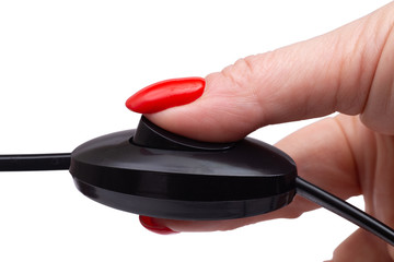 Female hand with toggle switch and electrical cable isolated on a white background