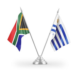 Uruguay and South Africa table flags isolated on white 3D rendering