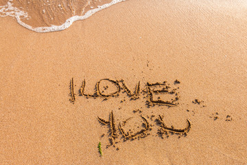 I love you written on the beach