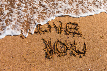 Fototapeta premium I love you written on the beach