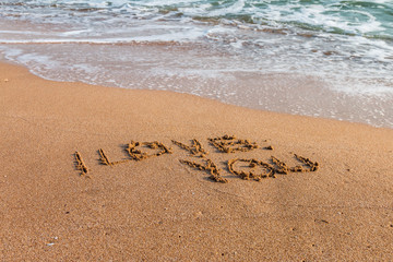 I love you written on the beach